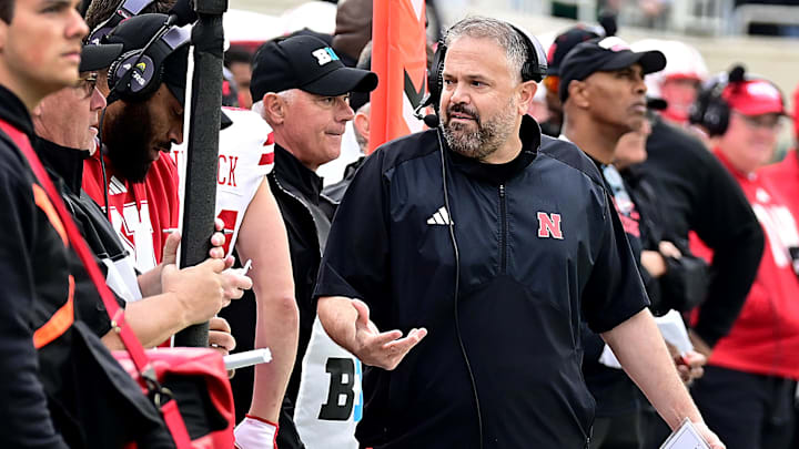 Nov 4, 2023; East Lansing, Michigan, USA; Nebraska Cornhuskers head coach Matt Rhule gestures while talking with assistants on the sideline against the Michigan State Spartans in the first half at Spartan Stadium. Mandatory Credit: Dale Young-Imagn Images