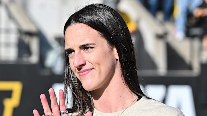 Oct 26, 2024: Former Iowa Hawkeye and current Indiana Fever WNBA star Caitlin Clark looks on while being honored during the game between the Iowa Hawkeyes and the Northwestern Wildcats