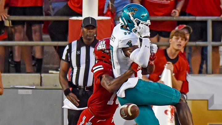 Coastal Carolina's Cameron Wright tries to make a catch as Jacksonville State's Zechariah Poyser breaks up the play during college football action at Burgess-Snow Field AmFirst Stadium in Jacksonville, Alabama August 29, 2024. (Dave Hyatt / Special to the Gadsden Times)