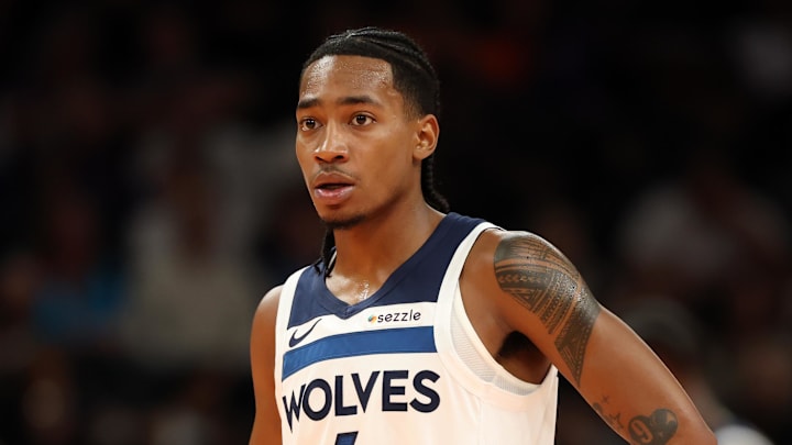 Nov 21, 2025; Phoenix, Arizona, USA; Minnesota Timberwolves guard Rob Dillingham (4) against the Phoenix Suns during an NBA Cup game at Mortgage Matchup Center. Mandatory Credit: Mark J. Rebilas-Imagn Images