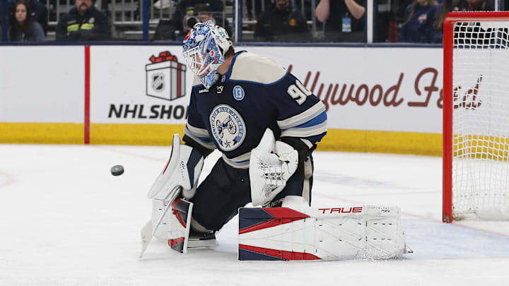 Dec 19, 2024; Columbus, Ohio, USA; Columbus Blue Jackets goalie Elvis Merzlikins (90) makes a pad save against the New Jersey Devils during the third period at Nationwide Arena. Mandatory Credit: Russell LaBounty-Imagn Images