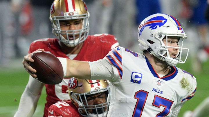 Dec 7, 2020; Glendale, Arizona, USA; Buffalo Bills quarterback Josh Allen (17) gets away from San Francisco 49ers defensive end Kerry Hyder (92) during the second half at State Farm Stadium. Mandatory Credit: Joe Camporeale-Imagn Images