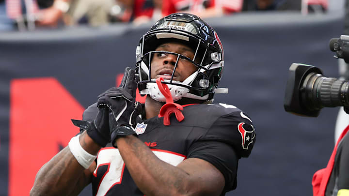 Nov 9, 2025; Houston, Texas, USA; Houston Texans running back Woody Marks (27) reacts after scoring a touchdown against the Jacksonville Jaguars during the first half at NRG Stadium.