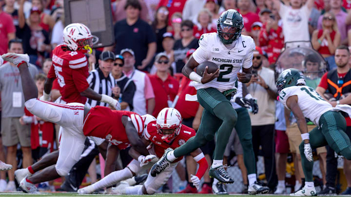 Oct 4, 2025; Lincoln, Nebraska, USA; Michigan State Spartans quarterback Aidan Chiles (2) rushes for a touchdown during the game against Nebraska at Memorial Stadium. Mandatory Credit: Kylie Graham-Imagn Images Oct 4, 2025; Lincoln, Nebraska, USA; Michigan State Spartans quarterback Aidan Chiles (2) rushes for a touchdown during the game against Nebraska at Memorial Stadium. Mandatory Credit: Kylie Graham-Imagn Images
