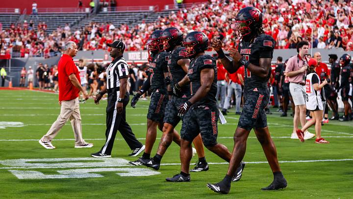 Sep 11, 2026; Raleigh, North Carolina, USA; NC State Wolfpack NC State Wolfpack cornerback Brian Nelson II #7, linebacker Popo Aguirre #0, running back Jayden Scott #1 and quarterback CJ Bailey #11 walk out for the coin toss before the first half of the game against Richmond Spiders at Carter-Finley Stadium. Mandatory Credit: Jaylynn Nash-Imagn Images Sep 11, 2026; Raleigh, North Carolina, USA; NC State Wolfpack NC State Wolfpack cornerback Brian Nelson II #7, linebacker Popo Aguirre #0, running back Jayden Scott #1 and quarterback CJ Bailey #11 walk out for the coin toss before the first half of the game against Richmond Spiders at Carter-Finley Stadium. Mandatory Credit: Jaylynn Nash-Imagn Images