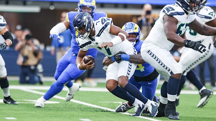 Jan 5, 2025; Inglewood, California, USA; Los Angeles Rams defensive end Desjuan Johnson (94) sacks Seattle Seahawks quarterback Geno Smith (7) at SoFi Stadium. Mandatory Credit: William Navarro-Imagn Images Jan 5, 2025; Inglewood, California, USA; Los Angeles Rams defensive end Desjuan Johnson (94) sacks Seattle Seahawks quarterback Geno Smith (7) at SoFi Stadium. Mandatory Credit: William Navarro-Imagn Images
