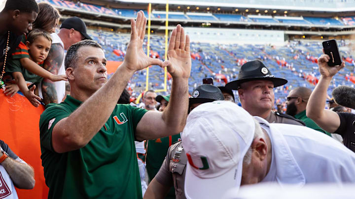 Aug 31, 2024; Gainesville, Florida, USA; Miami Hurricanes head coach Mario Cristobal gestures after a game against the Florida Gators at Ben Hill Griffin Stadium. Mandatory Credit: Matt Pendleton-Imagn Images
