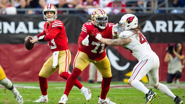 Dec 17, 2023; Glendale, Arizona, USA; San Francisco 49ers offensive lineman Trent Williams (71) blocks for quarterback Brock Purdy (13) against Arizona Cardinals linebacker Dennis Gardeck (45) at State Farm Stadium. Mandatory Credit: Mark J. Rebilas-USA TODAY Sports Dec 17, 2023; Glendale, Arizona, USA; San Francisco 49ers offensive lineman Trent Williams (71) blocks for quarterback Brock Purdy (13) against Arizona Cardinals linebacker Dennis Gardeck (45) at State Farm Stadium. Mandatory Credit: Mark J. Rebilas-USA TODAY Sports