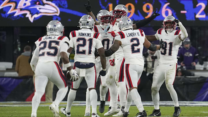 Dec 21, 2025; Baltimore, Maryland, USA;  New England Patriots cornerback Marcus Jones (25)  celebraets a fumble recovery with teammates during the second half of the game against the Baltimore Ravens at M&T Bank Stadium. Mandatory Credit: James Lang-Imagn Images