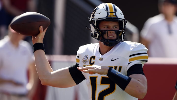 Oct 26, 2024; Tuscaloosa, Alabama, USA;  Missouri Tigers quarterback Brady Cook (12) warms up at Bryant-Denny Stadium. Mandatory Credit: Butch Dill-Imagn Images