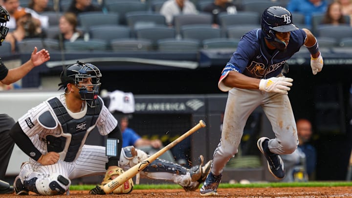 Bronx, New York, USA; Tampa Bay Rays center fielder Chandler Simpson (14) hits an infield single during the fifth inning against the New York Yankees at Yankee Stadium. Bronx, New York, USA; Tampa Bay Rays center fielder Chandler Simpson (14) hits an infield single during the fifth inning against the New York Yankees at Yankee Stadium.