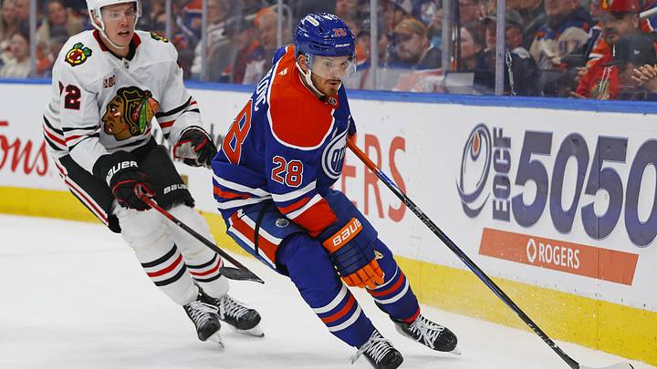 Nov 1, 2025; Edmonton, Alberta, CAN; Edmonton Oilers forward Jack Roslovic (28) protects the puck from Chicago Blackhawks defensemen Alex Vlasic (72) during the third period at Rogers Place. Mandatory Credit: Perry Nelson-Imagn Images Nov 1, 2025; Edmonton, Alberta, CAN; Edmonton Oilers forward Jack Roslovic (28) protects the puck from Chicago Blackhawks defensemen Alex Vlasic (72) during the third period at Rogers Place. Mandatory Credit: Perry Nelson-Imagn Images