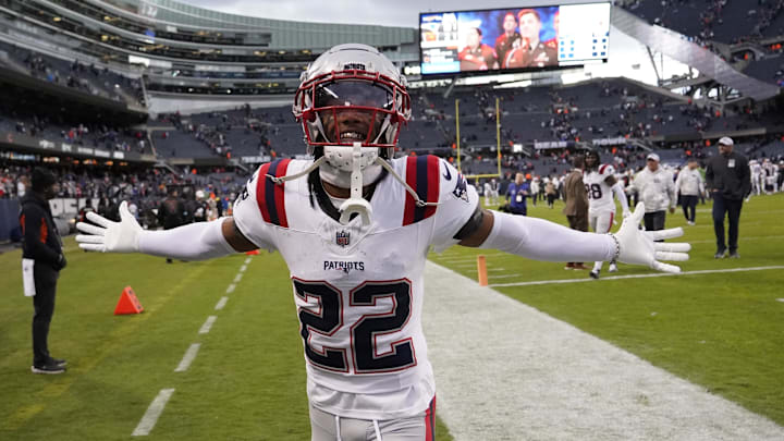 Nov 10, 2024; Chicago, Illinois, USA; New England Patriots cornerback Marco Wilson (22) celebrates the win against the Chicago Bears at Soldier Field. Mandatory Credit: David Banks-Imagn Images