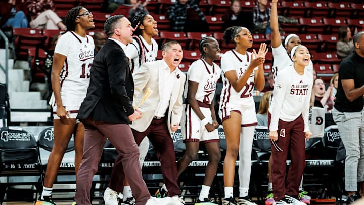 Mississippi State coaches and players celebrate a play during Monday's season-opening game against Davidson. Mississippi State coaches and players celebrate a play during Monday's season-opening game against Davidson.