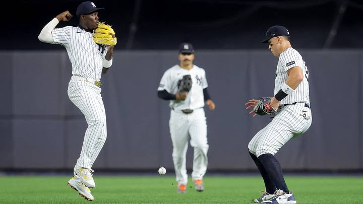 Sep 5, 2025; Bronx, New York, USA; A single hit by Toronto Blue Jays shortstop Bo Bichette (not pictured) falls between New York Yankees second baseman Jazz Chisholm Jr. (13) and center fielder Trent Grisham (12) and right fielder Aaron Judge (99) during the fifth inning at Yankee Stadium. Mandatory Credit: Brad Penner-Imagn Images