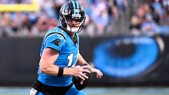 Oct 13, 2024; Charlotte, North Carolina, USA; Carolina Panthers quarterback Andy Dalton (14) with the ball in the second quarter at Bank of America Stadium. Mandatory Credit: Bob Donnan-Imagn Images