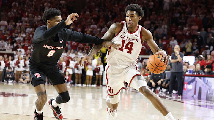 Oklahoma Sooners forward Jalon Moore (14) 