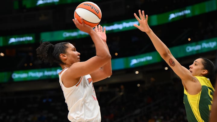 May 23, 2025; Seattle, Washington, USA; Phoenix Mercury forward Alyssa Thomas (25) shoots the ball against the Seattle Storm during the second half at Climate Pledge Arena. Mandatory Credit: Steven Bisig-Imagn Images