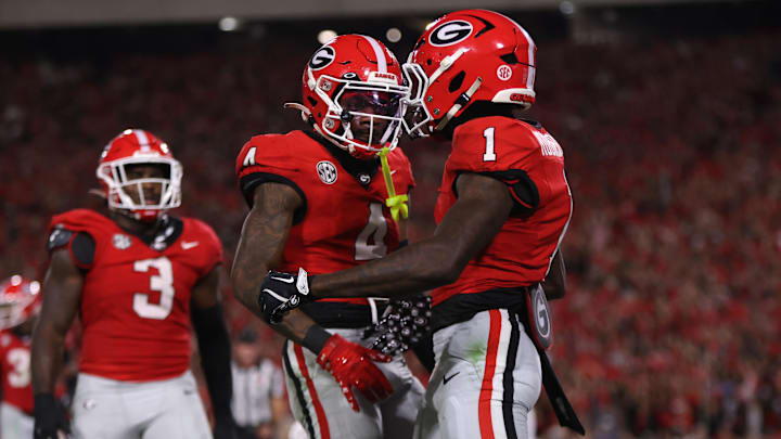 Sep 27, 2025; Athens, Georgia, USA; Georgia Bulldogs defensive back Ellis Robinson IV (1) and defensive back KJ Bolden (4) react in the first half against the Alabama Crimson Tide at Sanford Stadium. Mandatory Credit: Brett Davis-Imagn Images