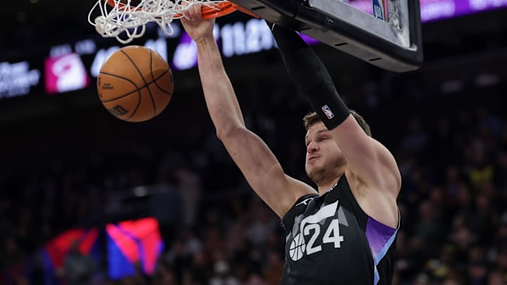 Jan 9, 2025; Salt Lake City, Utah, USA;  Utah Jazz center Walker Kessler (24) dunks the ball against the Miami Heat during the second half at Delta Center. Mandatory Credit: Chris Nicoll-Imagn Images