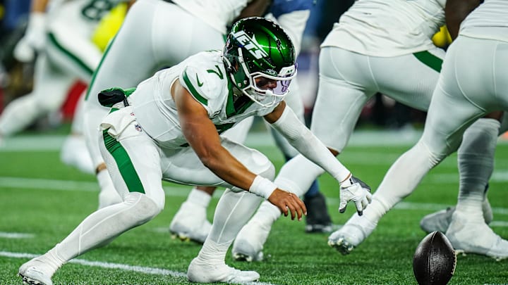 Nov 13, 2025; Foxborough, Massachusetts, USA; New York Jets quarterback Justin Fields (7) looses the ball on the snap against the New England Patriots in the fourth quarter at Gillette Stadium. Mandatory Credit: David Butler II-Imagn Images