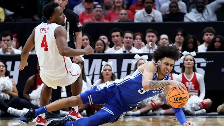 Mar 29, 2024; Dallas, TX, USA; Duke basketball guard Tyrese Proctor (5) and Houston Cougars guard L.J. Cryer (4) chase a loose ball during the second half in the semifinals of the South Regional of the 2024 NCAA Tournament at American Airlines Center. 
