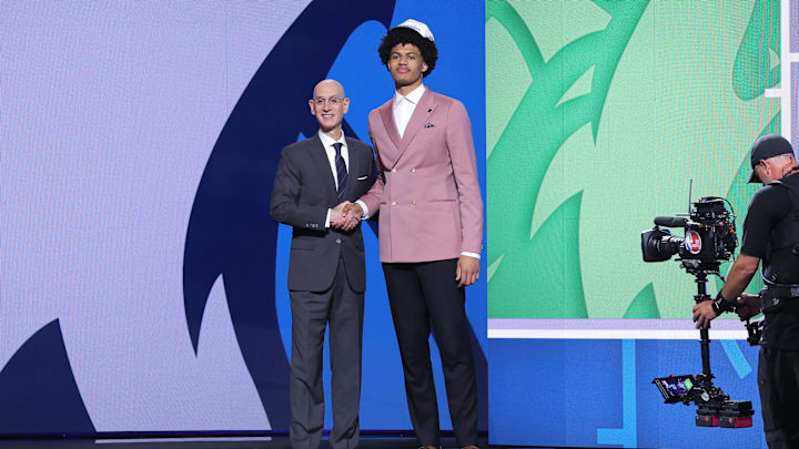 Jun 25, 2025; Brooklyn, NY, USA;  Joan Beringer stands with NBA commissioner Adam Silver after being selected as the 17th pick by the Minnesota Timberwolves in the first round of the 2025 NBA Draft at Barclays Center. Mandatory Credit: Brad Penner-Imagn Images