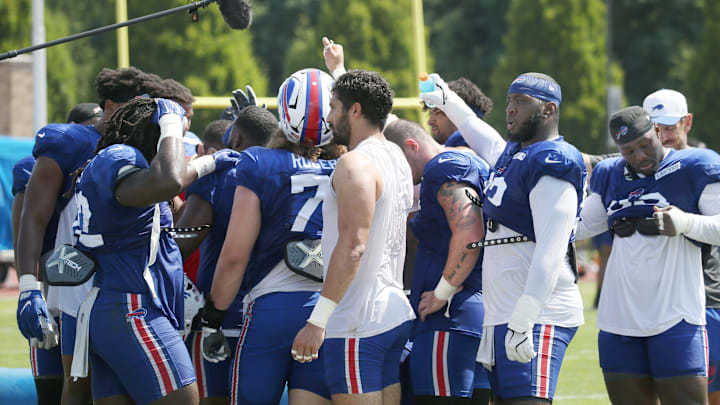The defensive unit huddles at the end of practice during day 5 of Buffalo Bills training camp at St. John Fisher University