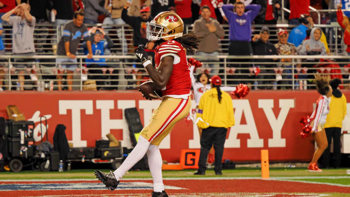Jan 28, 2024; Santa Clara, California, USA; San Francisco 49ers wide receiver Brandon Aiyuk (11) reacts after catching a ball that bounced off the face mask of Detroit Lions cornerback Kindle Vildor (not pictured) during the second half of the NFC Championship football game at Levi's Stadium. Mandatory Credit: Kelley L Cox-USA TODAY Sports