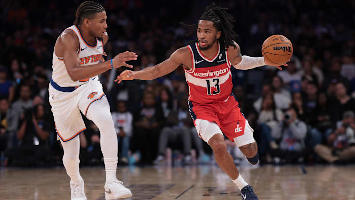 Oct 13, 2025; New York, New York, USA; Washington Wizards guard Sharife Cooper (13) dribbles against New York Knicks guard Miles McBride (2) during the second half at Madison Square Garden. Mandatory Credit: Vincent Carchietta-Imagn Images