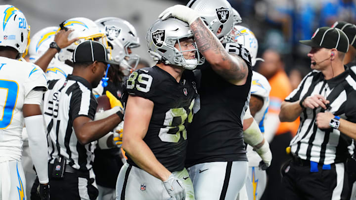 Jan 5, 2025; Paradise, Nevada, USA; Las Vegas Raiders center Andre James (68) consoles Las Vegas Raiders tight end Brock Bowers (89) after a missed reception against the Los Angeles Chargers during the fourth quarter at Allegiant Stadium. Mandatory Credit: Stephen R. Sylvanie-Imagn Images Jan 5, 2025; Paradise, Nevada, USA; Las Vegas Raiders center Andre James (68) consoles Las Vegas Raiders tight end Brock Bowers (89) after a missed reception against the Los Angeles Chargers during the fourth quarter at Allegiant Stadium. Mandatory Credit: Stephen R. Sylvanie-Imagn Images
