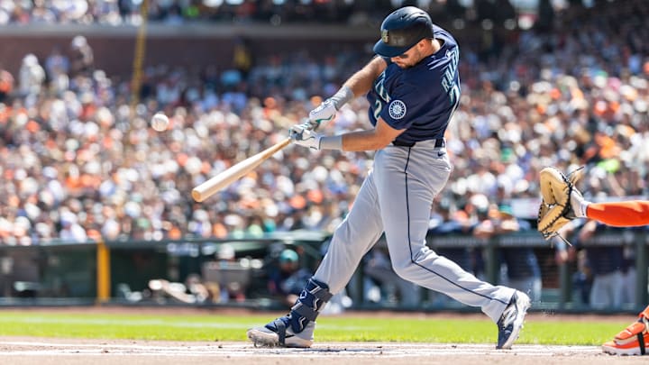 Seattle Mariners catcher Cal Raleigh singles during a game against the San Francisco Giants on April 4 at Oracle Park. Seattle Mariners catcher Cal Raleigh singles during a game against the San Francisco Giants on April 4 at Oracle Park.