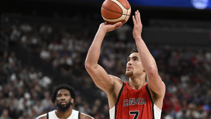 Jul 10, 2024; Las Vegas, Nevada, USA; Canada forward Dwight Powell (7) shoots a free throw against USA in the third quarter in the USA Basketball Showcase at T-Mobile Arena. Mandatory Credit: Candice Ward-USA TODAY Sports Jul 10, 2024; Las Vegas, Nevada, USA; Canada forward Dwight Powell (7) shoots a free throw against USA in the third quarter in the USA Basketball Showcase at T-Mobile Arena. Mandatory Credit: Candice Ward-USA TODAY Sports