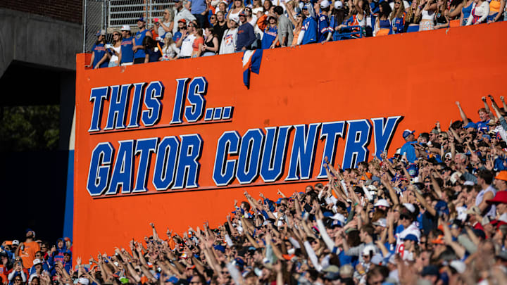 Nov 23, 2024; Gainesville, Florida, USA; Fans cheer in front of a sign during the second half between the Florida Gators and Mississippi Rebels at Ben Hill Griffin Stadium. Mandatory Credit: Matt Pendleton-Imagn Images