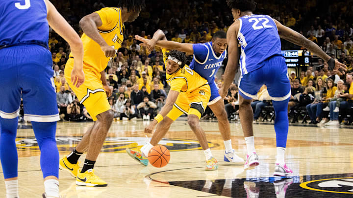 Mar 8, 2025; Columbia, Missouri, USA; Missouri Tigers guard Anthony Robinson II (2) loses control of the ball during a game against the Kentucky Wildcats at Mizzou Arena.