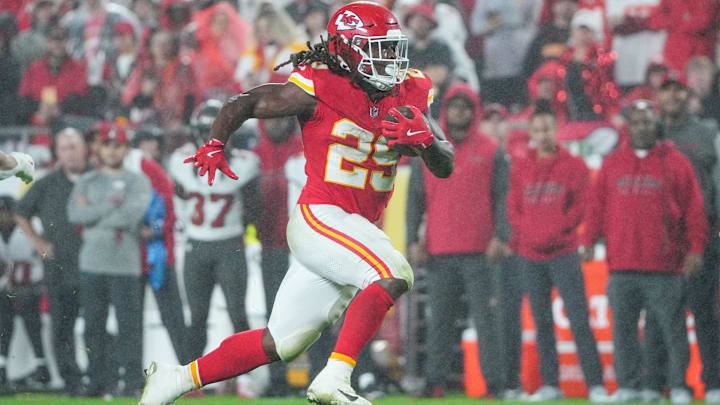 Nov 4, 2024; Kansas City, Missouri, USA; Kansas City Chiefs running back Kareem Hunt (29) runs the ball against the Tampa Bay Buccaneers during the second half at GEHA Field at Arrowhead Stadium. 