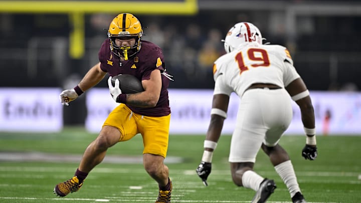 Dec 7, 2024; Arlington, TX, USA; Arizona State Sun Devils running back Cam Skattebo (4) and Iowa State Cyclones defensive back Ta'Shawn James (19) in action during the game between the Iowa State Cyclones and the Arizona State Sun Devils at AT&T Stadium. Mandatory Credit: Jerome Miron-Imagn Images