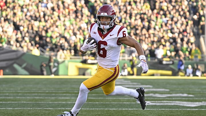 Nov 22, 2025; Eugene, Oregon, USA; Southern California Trojans wide receiver Makai Lemon (6) runs with the ball during the first half against the Oregon Ducks at Autzen Stadium. Mandatory Credit: Troy Wayrynen-Imagn Images