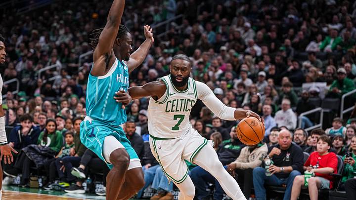 Boston Celtics guard Jaylen Brown (7) drives the ball against Charlotte Hornets guard Sion James 
