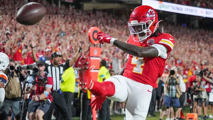 Kansas City Chiefs wide receiver Rashee Rice (4) kicks the ball after scoring a touchdown against the Denver Broncos during the game at GEHA Field at Arrowhead Stadium. Mandatory Credit: Denny Medley-Imagn Images
