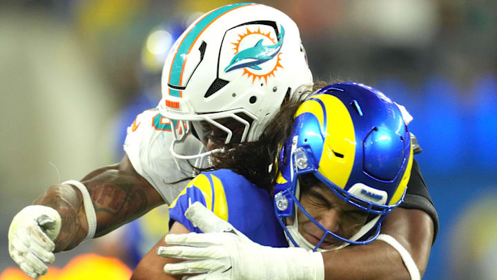 Los Angeles Rams wide receiver Puka Nacua (17) is tackled by Miami Dolphins linebacker Quinton Bell (56) in the second half at SoFi Stadium. Los Angeles Rams wide receiver Puka Nacua (17) is tackled by Miami Dolphins linebacker Quinton Bell (56) in the second half at SoFi Stadium.