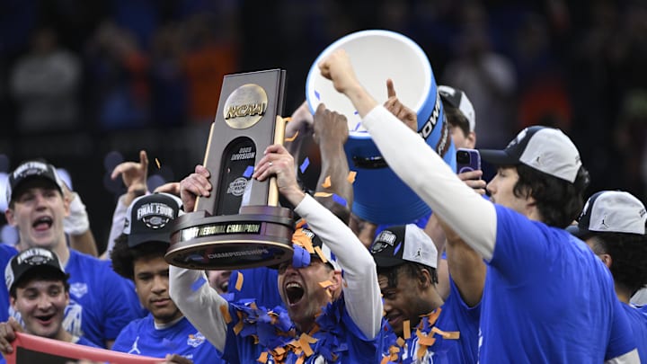 Florida holds the NCAA regional trophy aloft after advancing to the Final Four.