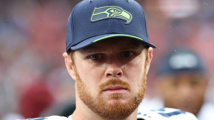 Seattle Seahawks quarterback Sam Darnold stands on the field