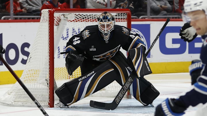 Feb 1, 2025; Washington, District of Columbia, USA; Washington Capitals goaltender Logan Thompson (48) follows the puck as Winnipeg Jets center Vladislav Namestnikov (7) skates in the second period at Capital One Arena. Mandatory Credit: Geoff Burke-Imagn Images