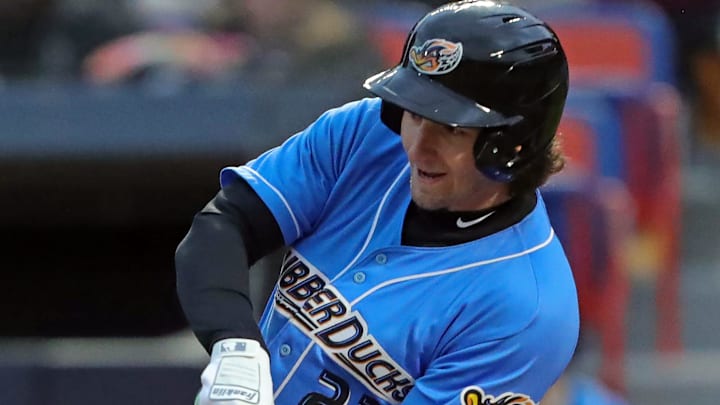 Akron RubberDucks centerfielder Chase DeLauter (22) connects with a pitch during the first inning of an opening-day baseball game at Canal Park on April 5, 2024, in Akron, Ohio. Akron RubberDucks centerfielder Chase DeLauter (22) connects with a pitch during the first inning of an opening-day baseball game at Canal Park on April 5, 2024, in Akron, Ohio.