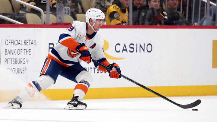 Dec 29, 2024; Pittsburgh, Pennsylvania, USA; New York Islanders center Brock Nelson (29) moves the puck against the Pittsburgh Penguins during the third period at PPG Paints Arena. Mandatory Credit: Charles LeClaire-Imagn Images Dec 29, 2024; Pittsburgh, Pennsylvania, USA; New York Islanders center Brock Nelson (29) moves the puck against the Pittsburgh Penguins during the third period at PPG Paints Arena. Mandatory Credit: Charles LeClaire-Imagn Images