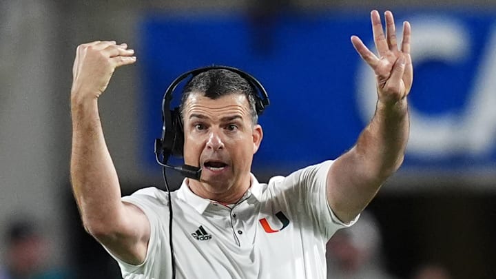 Dec 28, 2024; Orlando, FL, USA; Miami Hurricanes head coach Mario Cristobal reacts during the second half against the Iowa State Cyclones at Camping World Stadium. Mandatory Credit: Jasen Vinlove-Imagn Images