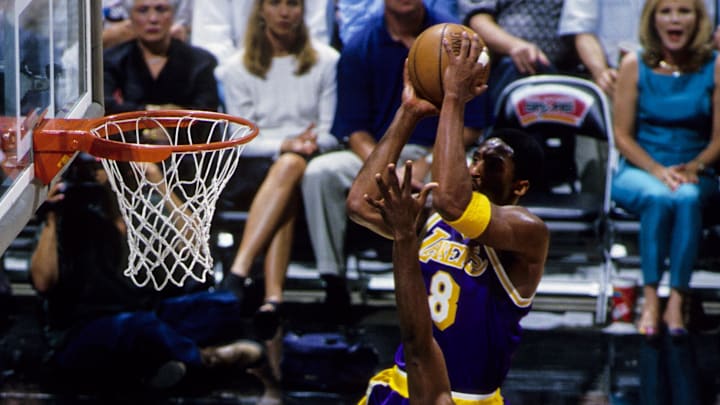May 1999; San Antonio, TX; USA; FILE PHOTO; Los Angeles Lakers guard Kobe Bryant (8) in action against San Antonio Spurs forwards Malik Rose (31) and Tim Duncan (21) during the second round of the 1999 NBA Playoffs at the Alamodome. Mandatory Credit: RVR Photos-Imagn Images May 1999; San Antonio, TX; USA; FILE PHOTO; Los Angeles Lakers guard Kobe Bryant (8) in action against San Antonio Spurs forwards Malik Rose (31) and Tim Duncan (21) during the second round of the 1999 NBA Playoffs at the Alamodome. Mandatory Credit: RVR Photos-Imagn Images