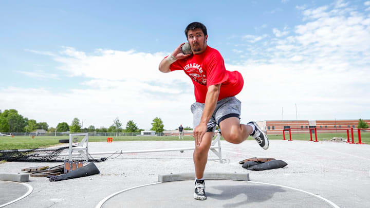 Jackson Cantwell spins around as he practices throwing a shotput during track and field practice at Nixa High School on Wednesday, April 24, 2024. On Friday, Cantwell, the nation's No. 1 football recruit for the Class of 2026, heaved the shot put five feet further than anyone has all season, the No. 2 mark by a junior all-time. 