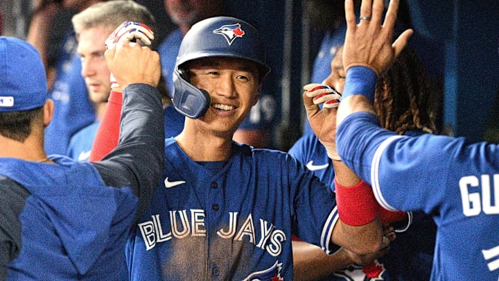 Apr 26, 2022; Toronto, Ontario, CAN; Toronto Blue Jays first baseman Gosuke Katoh (29) is greeted by